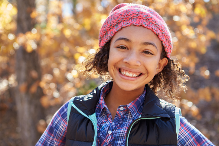 Image of a 11 Year Old Girl Outside Smiling