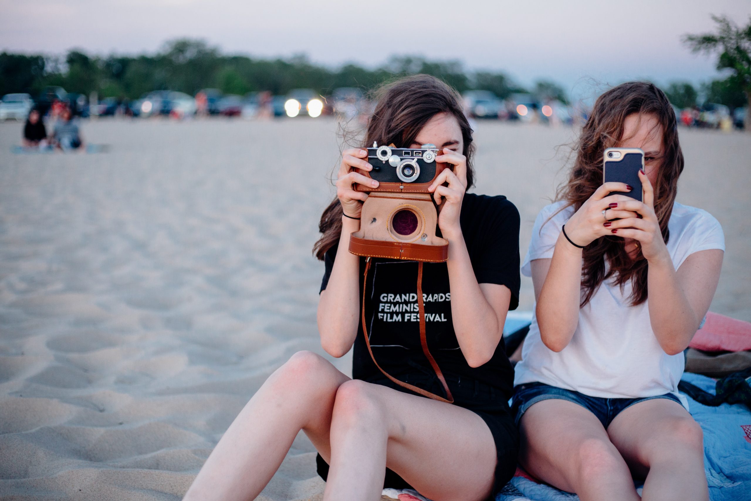 image of 18 year old girls using their cameras to take a picutre